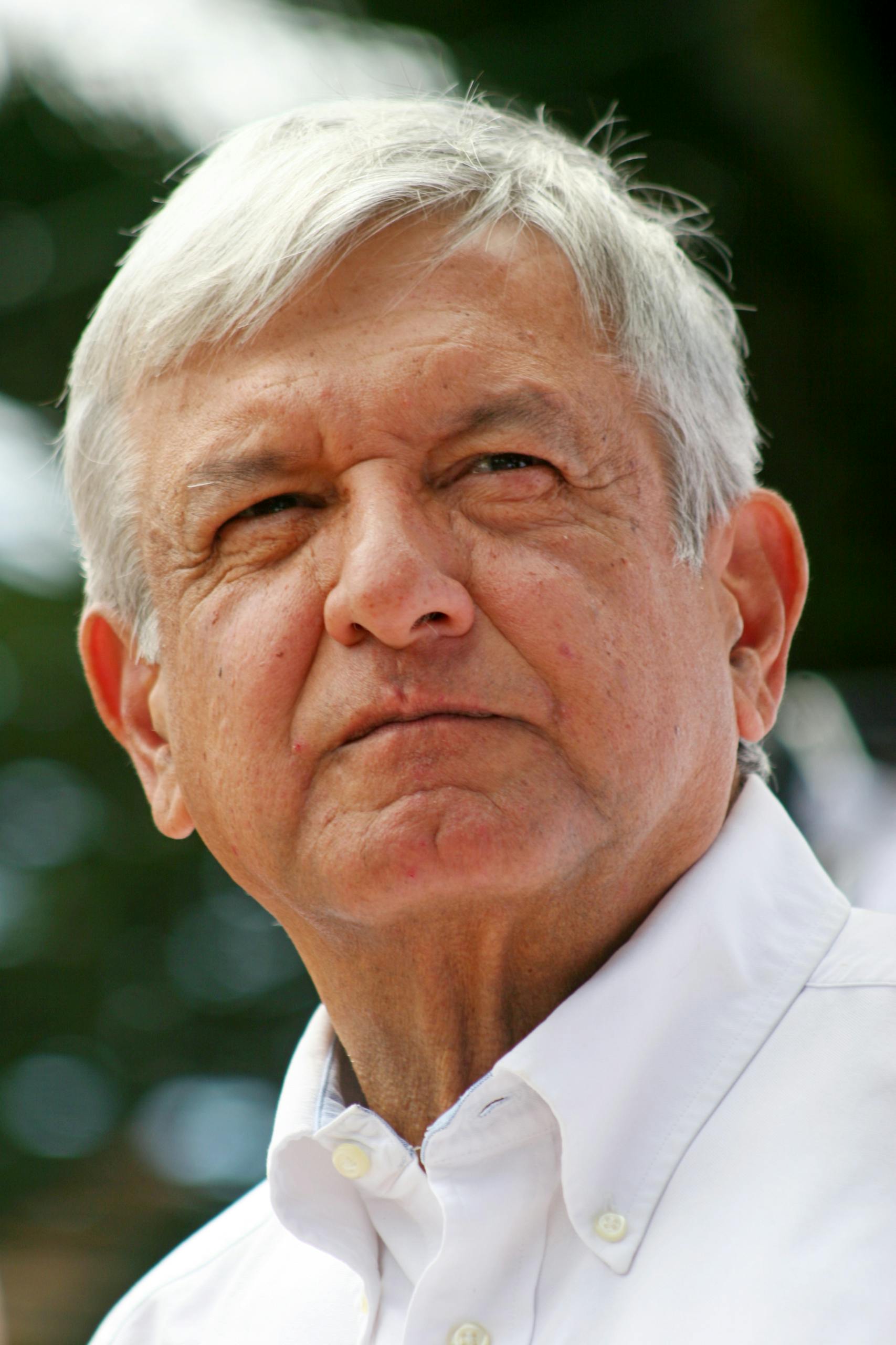 An Elderly Man in White Collared Shirt Looking Afar